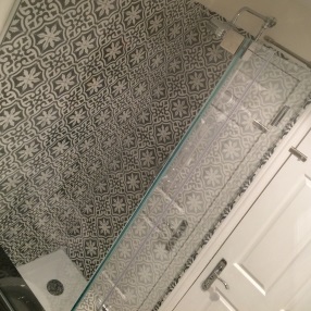 Encaustic tiles in wetroom and bathroom floor